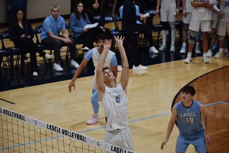 Freshman setter Trystan Maloney attacks the ball. (Photo courtesy of Lasell Athletics)