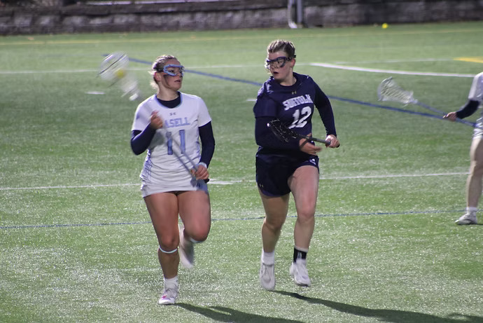 First-year Rhyan Pitari moves the ball up the field in a game against Suffolk University.