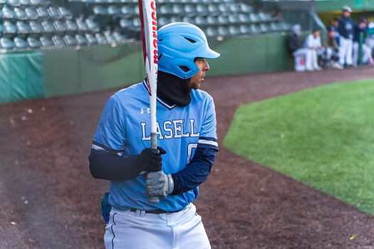 Graduate student Brad Edwards on deck against Fisher College. Edwards went 3 for 4 and drove in a run during Lasell's first game of the season, a 6-1 victory.