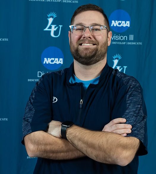 Softball head coach Paul Gray leads the team in his first year at Lasell. 