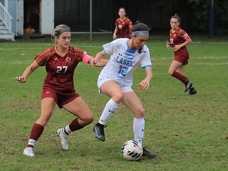 Graduate midfielder Bobbi O’Guin makes a turn with the ball against Regis College at Taylor Field. O’Guin started 18 of 19 matches this season, scoring six goals and assisting on five. 