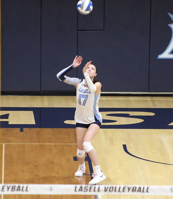 Eliana Baran serves the ball in the Athletic Center.