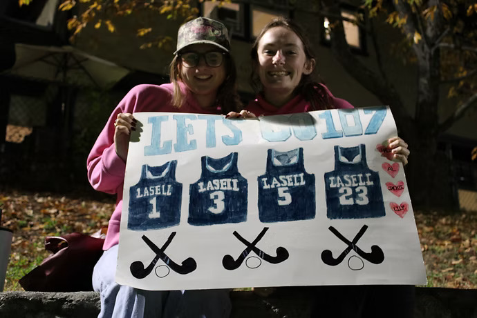 Two fans show their support for the field hockey team during its game vs. Saint Joseph's (Maine).