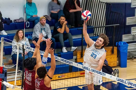 Junior outside hitter Jordan Shinaut attacks a ball in a Feb. 26 match against Vassar.  