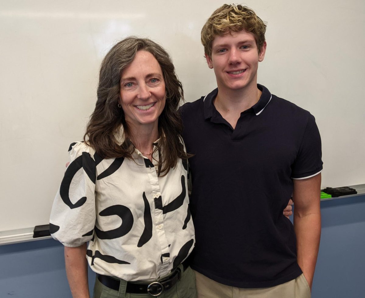 Deborah Baldizar (left), an associate professor of art and graphic design at Lasell University, poses with Colin Roderick, a sophomore psychology major, after speaking about the benefits of the school's Collaboration Recognition Program.