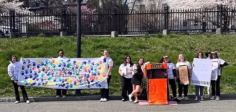J.A.I.L.L. group members advocating for their cause on the Boston Common. (Photo courtesy of Eftihia Fotos)