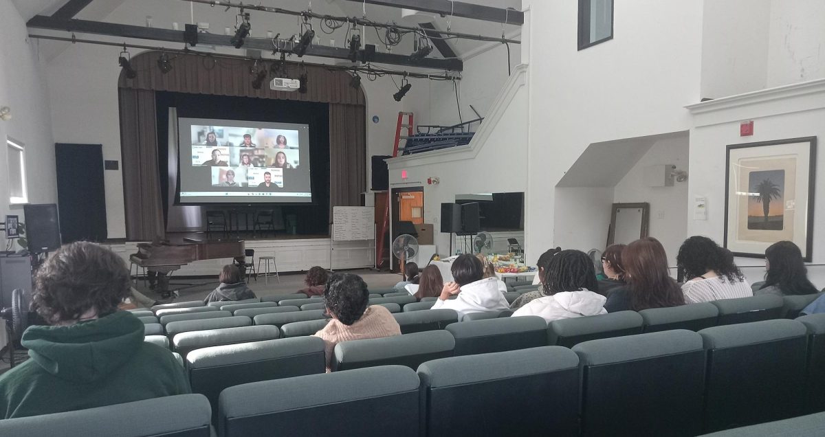 Students watch the Zoom broadcast of the Career Readiness Symposium in Yamawaki Auditorium at Lasell University on Oct. 14, 2025. (Photo courtesy of Jovonte Santos)