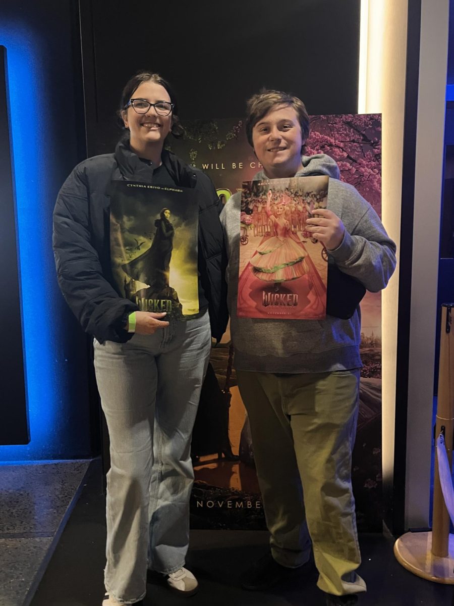Aria Conti (left) and Jacob Lustig attend the “Wicked: For Good” premiere at the AMC Theatre in Somerville.