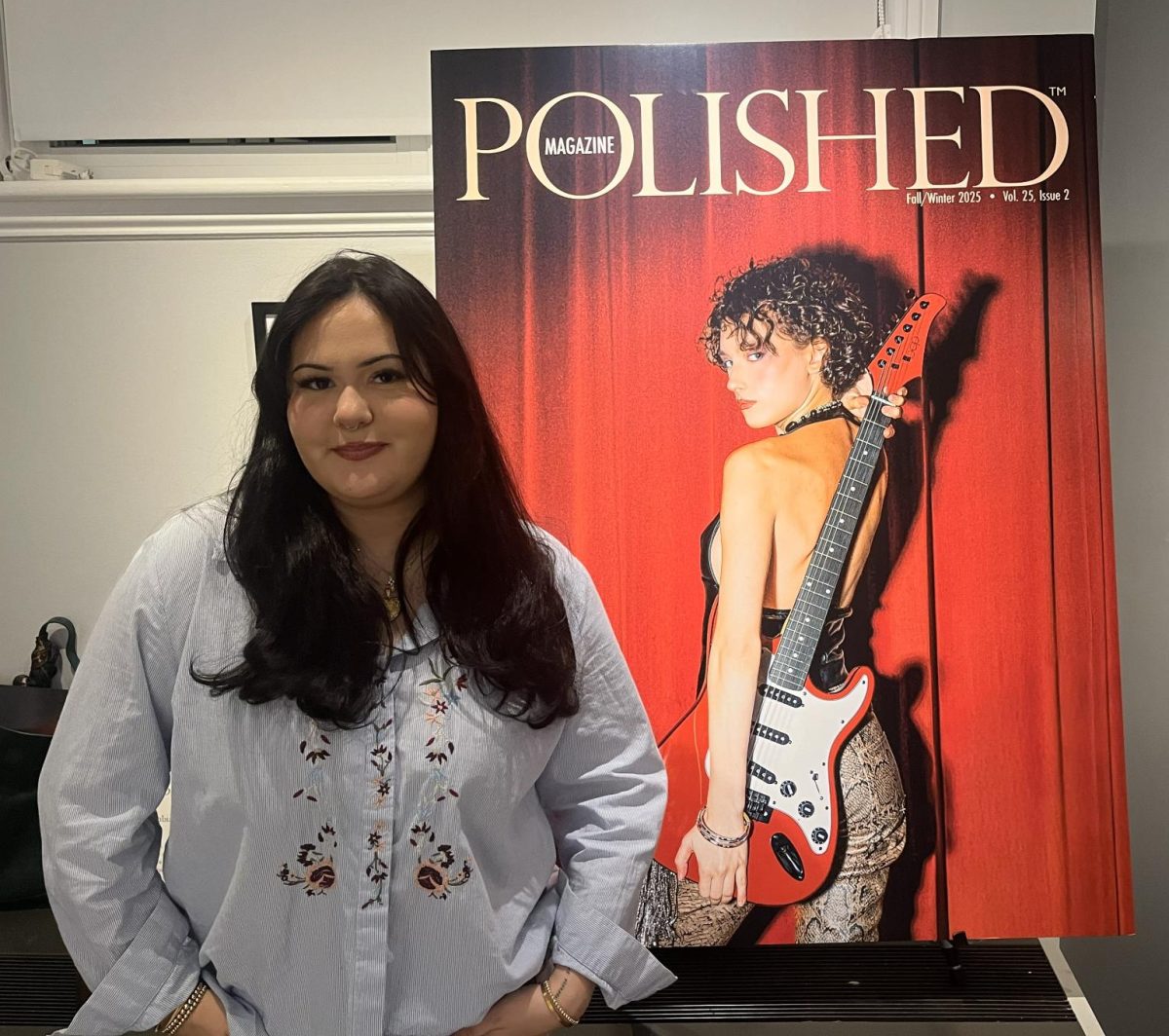 Ella Rivera poses next to the Fall/Winter 2025 edition of Polished Magazine. (Photo courtesy of Ella Rivera)