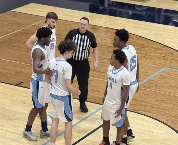 Lasell's Andy Madesko, Cameron Foster Martez, Esmer Madesko, Che Hanks, and Cameron Nell speak with the referee.