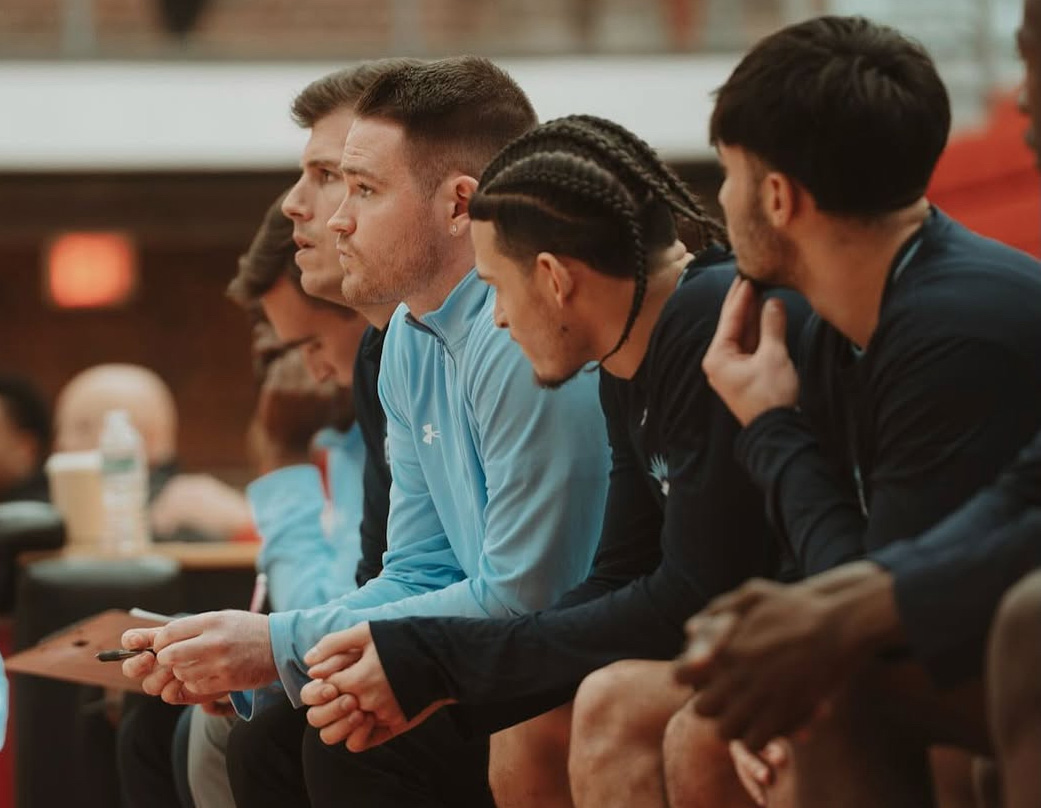 Conan McCusker (middle) joins the Lasell basketball coaching staff after a four-year stint as a guard for the Lasers. (Photo courtesy of Luisne McCusker)