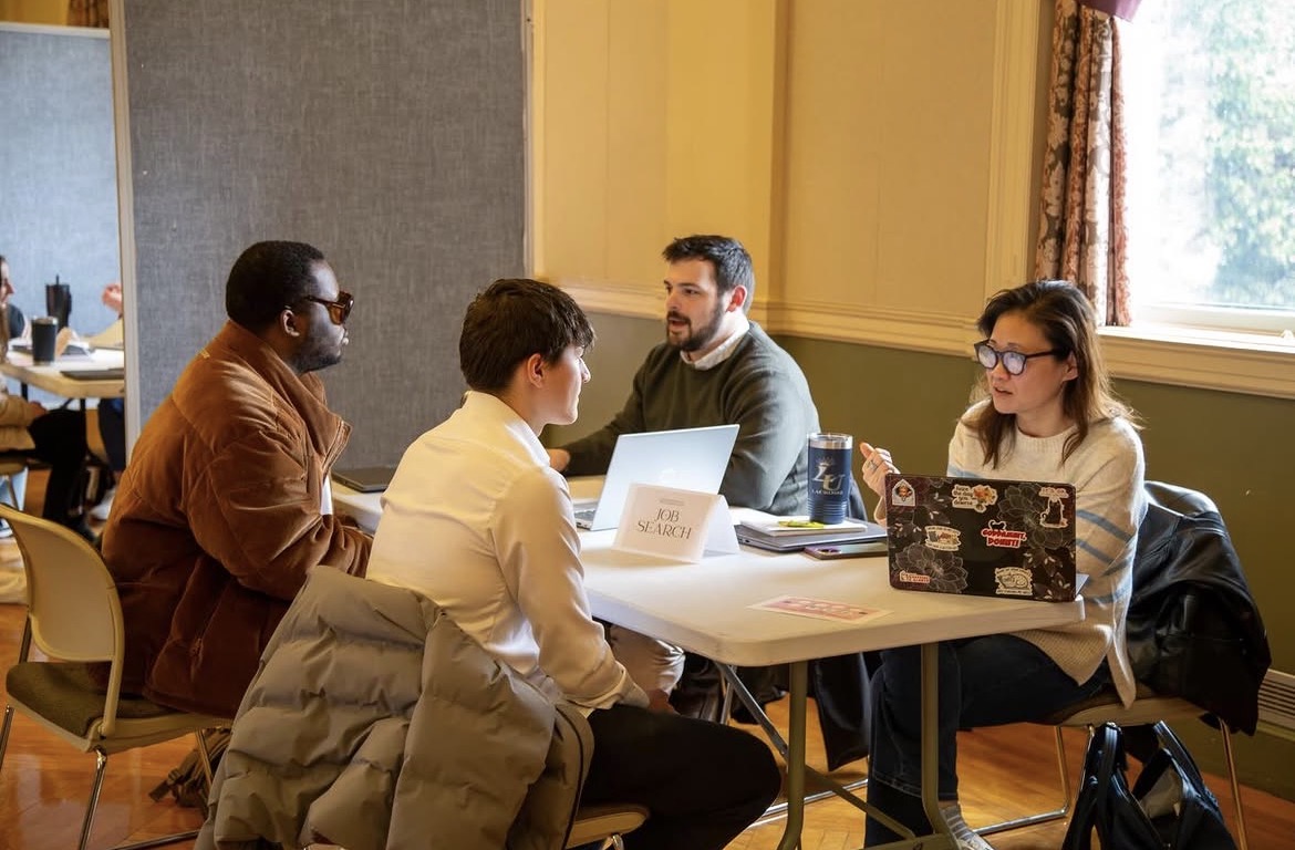 Students (L): Yaphet Browning and Ryan Mesnik sharpen their interview skills with admissions counselor Andrew Marcotte and professor of business Christina Alejandre. (Photo courtesy of Lasell Marketing and Communications)
